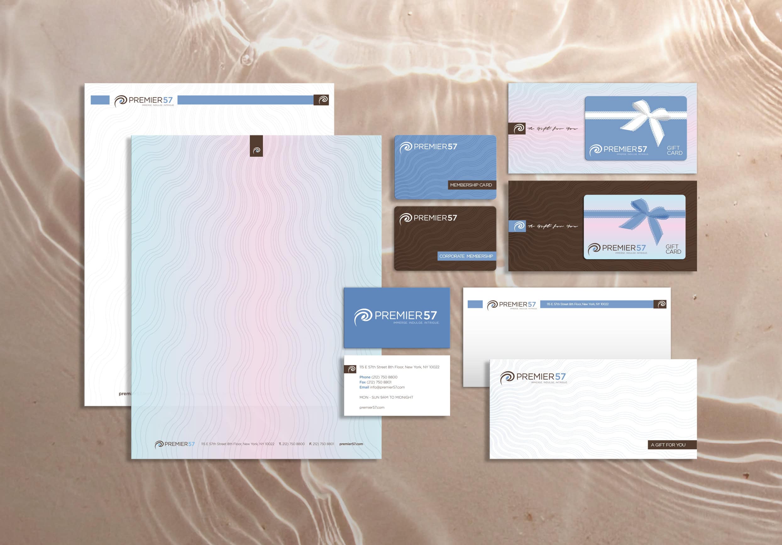 Elegant branding stationery set with custom business cards, gift cards, letterhead, and envelopes for Ahn GraphicX.